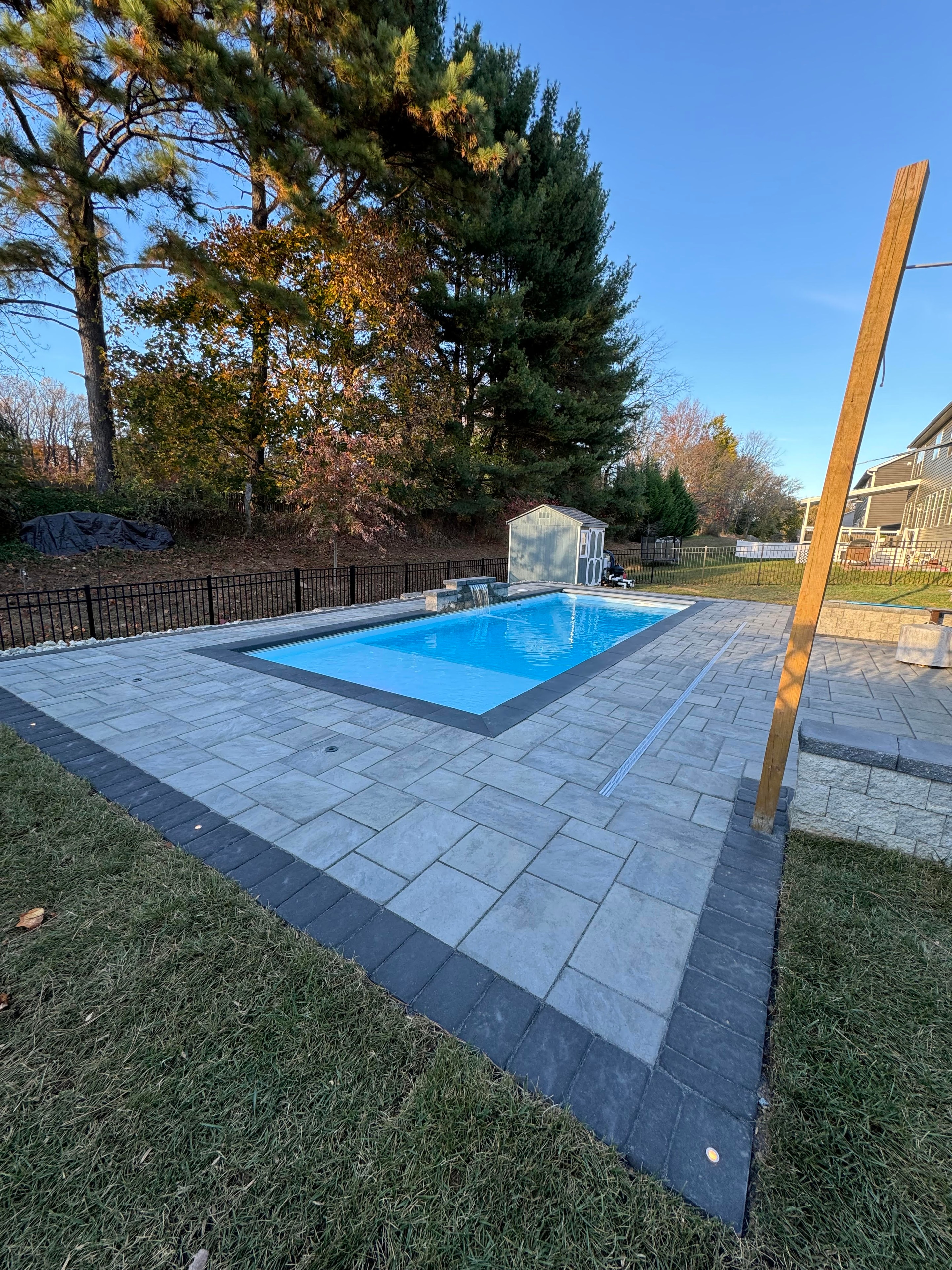 LandPro pool with paver surround and pool cover
